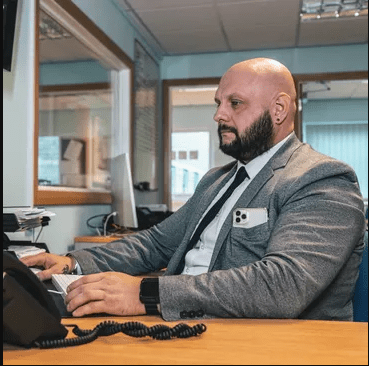 Image of recruitment consultant in front of the computer